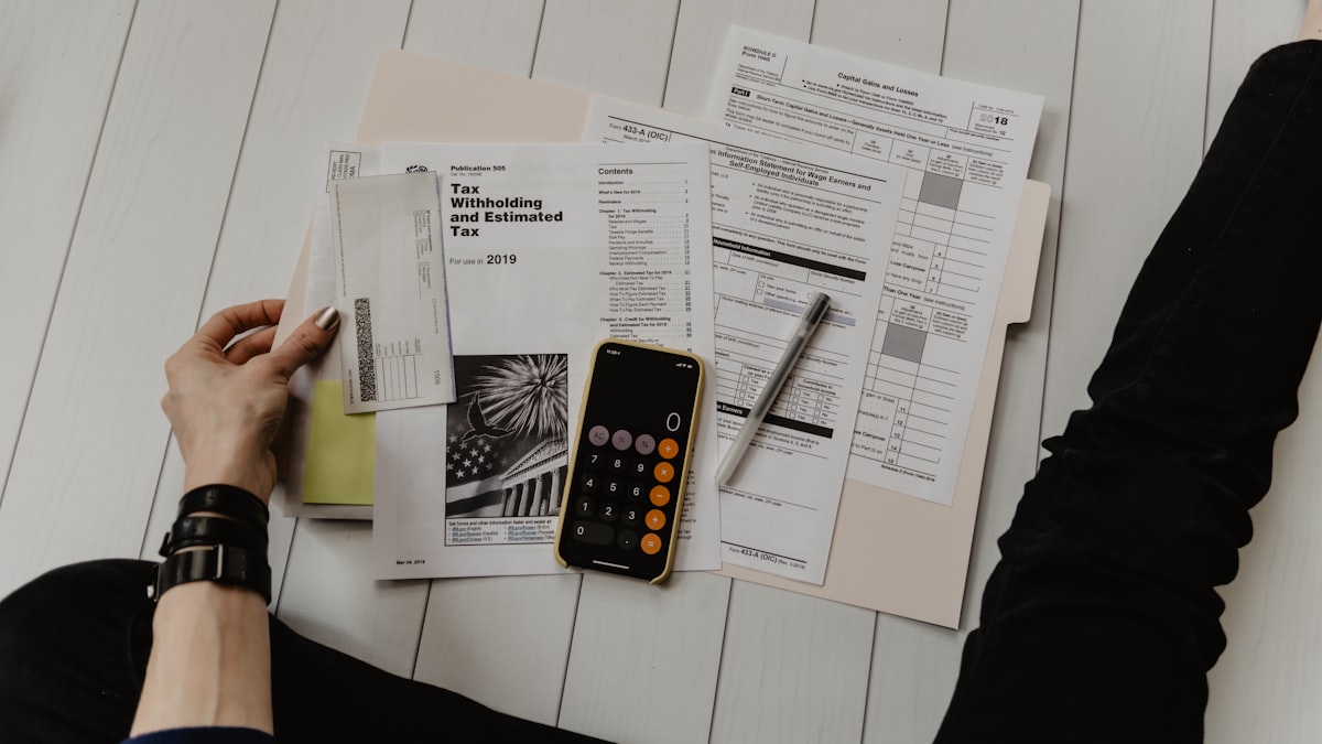 Calculator and financial documents — accountants handling sensitive client data need transfer tools that match the sensitivity of the files