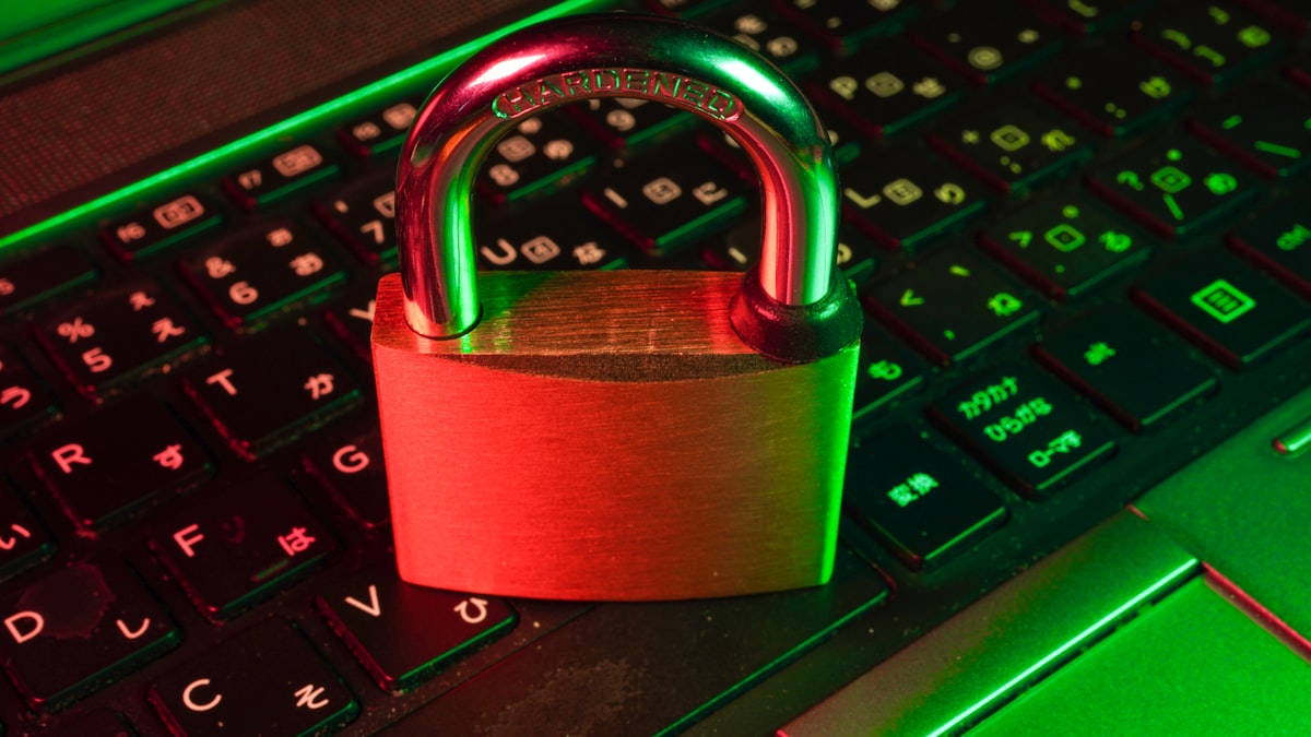 Red padlock on keyboard — email attachments sit on multiple servers without expiry, unlike encrypted file transfer